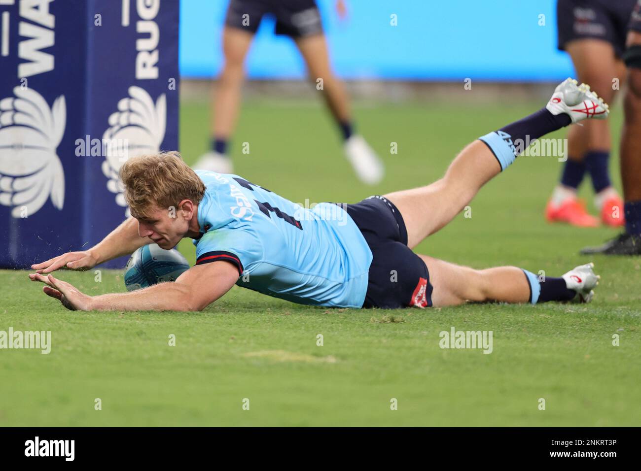 SYDNEY, AUSTRALIA - FEBRUARY 24: Max Jorgensen of Waratahs scores a try ...