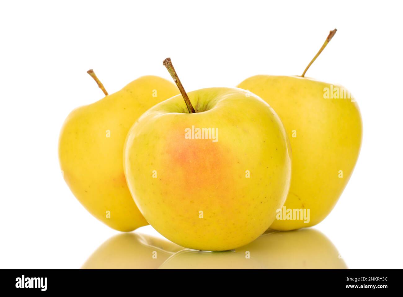 Three ripe juicy apples, macro, isolated on white background. Stock Photo