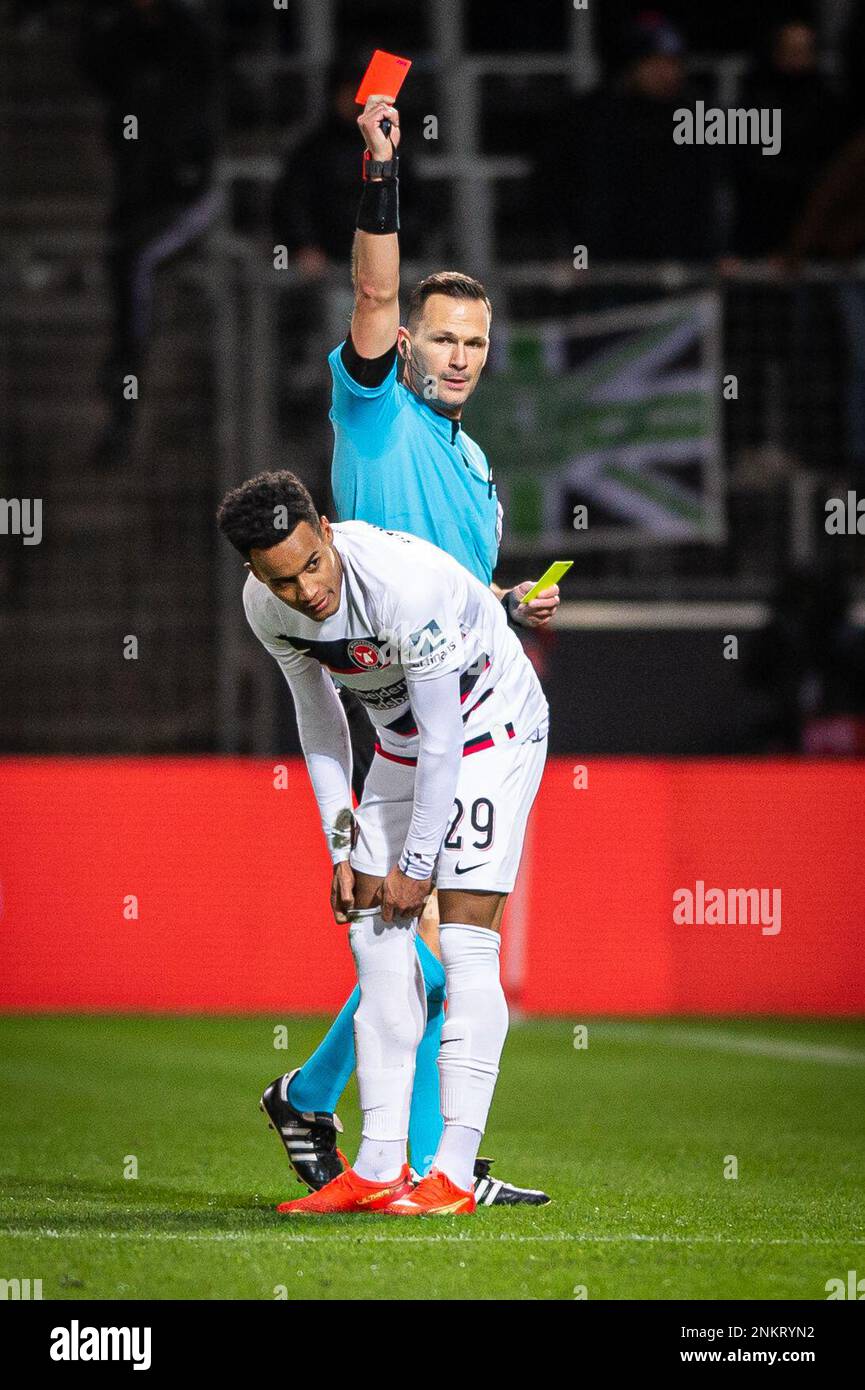 Herning, Denmark. 23rd Feb, 2023. Refereee Ivan Kruzliak hands out a red card to Paulinho (29) of FC Midtjylland during the UEFA Europa League match between FC Midtjylland and Sporting CP at MCH Arena in Herning. (Photo Credit: Gonzales Photo/Alamy Live News Stock Photo