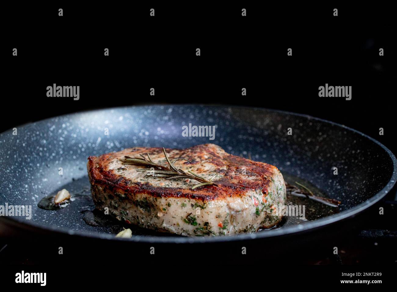 Grilled premium rib eye beef steak in the pan, cooking steak in the