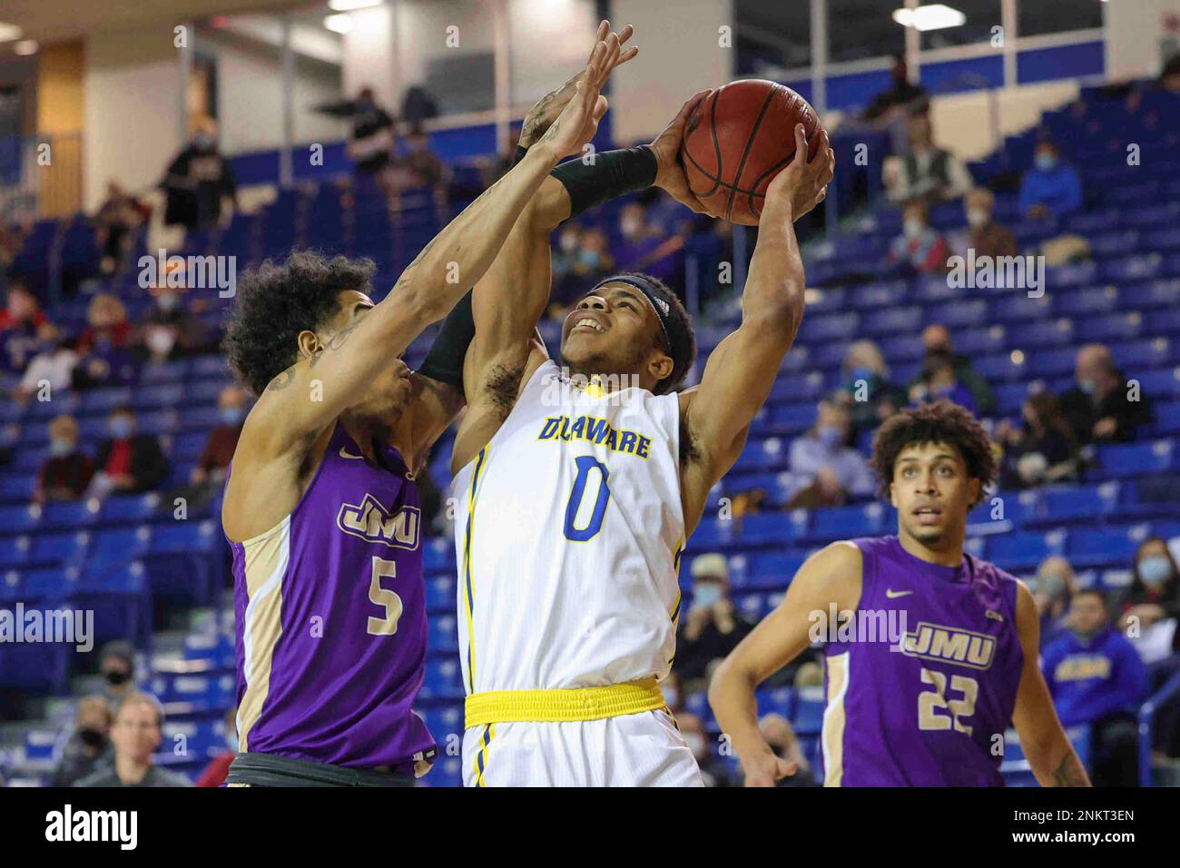 February 14, 2022, Newark, DE, United States: Delaware Guard JAMEER NELSON  JR. (0) drives to the basket as James Madison Guard TERRENCE EDWARDS (5)  defends during a CAA regular season contest Monday,