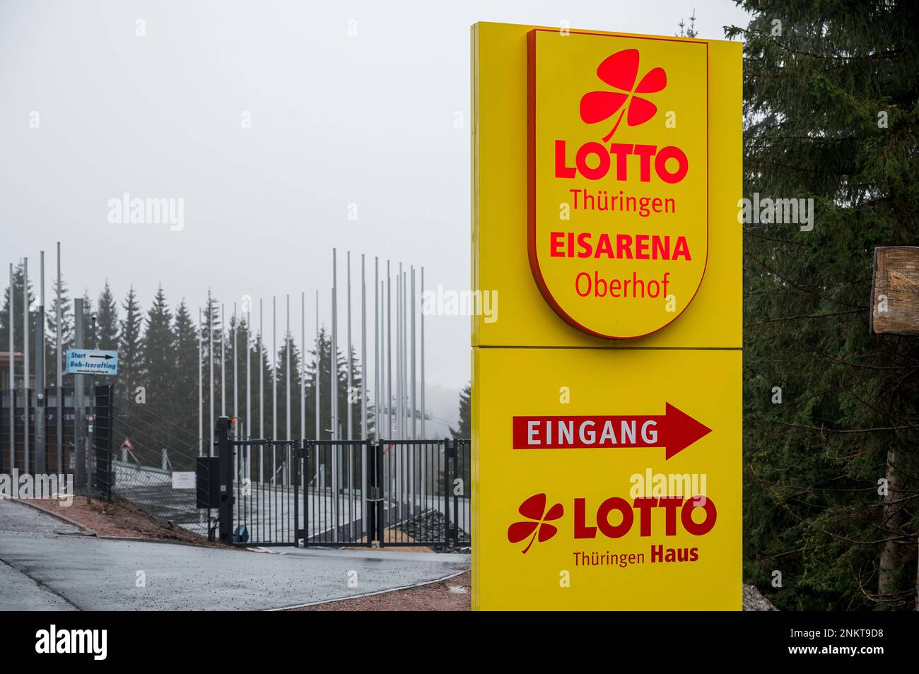 24 February 2023, Thuringia, Oberhof: A sign of the bobsleigh and luge track 'Lotto Thüringen Eisarena Oberhof'. In the background is the entrance area to the bobsleigh and icerafting. In a serious accident on the Oberhof bobsleigh and luge track, one person died on February 23. Another person was seriously injured. According to the investigations so far, the guest bobsleigh had run into two hose rings, so-called ice tubes, in the finish area. The man who was killed is said to have been in one of these tubular rings, with which laymen can also ride the track. Photo: Daniel Vogl/dpa Stock Photo