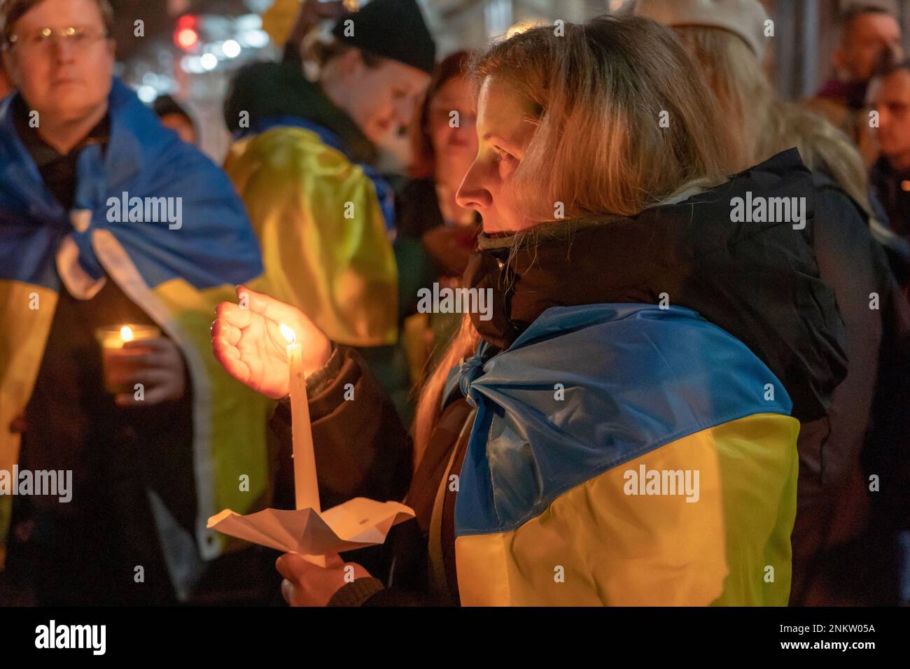 New York, United States. 23rd Feb, 2023. People gather at a candlelight vigil on the eve of the one year anniversary of full-scale Russian invasion outside of Russian's consulate building on Manhattan's Upper East Side in New York City. Ukrainians and Russians speak up against the war, Putin and mourn victims of the invasion. (Photo by Ron Adar/SOPA Images/Sipa USA) Credit: Sipa USA/Alamy Live News Stock Photo