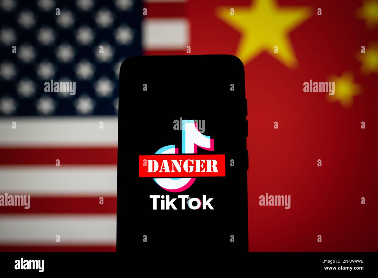 TikTok app logo crossed out with red Danger sign displayed on phone