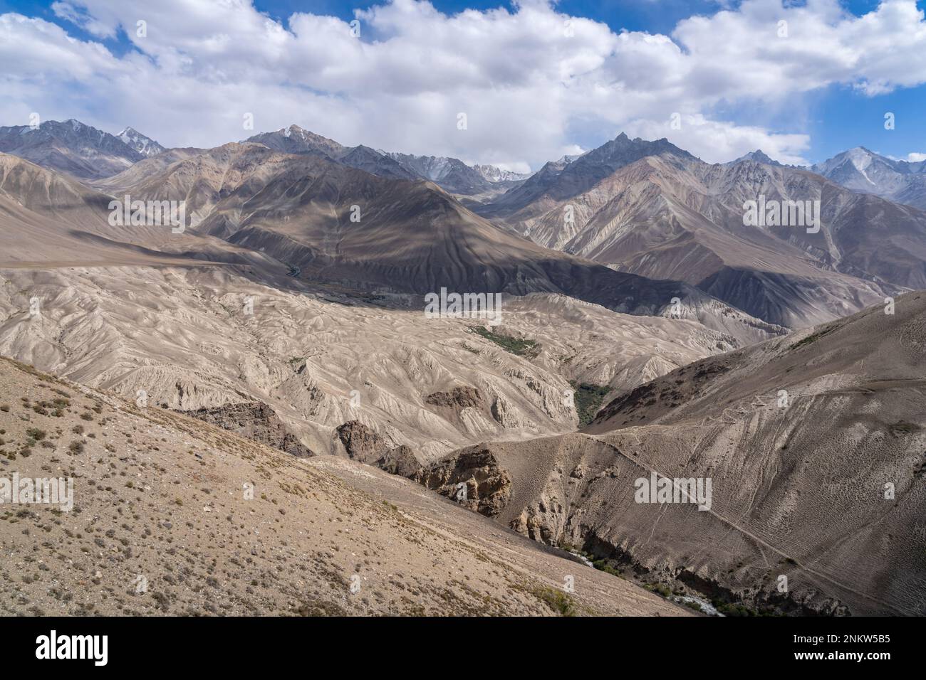 Landscape view of the Wakhan mountain range in Afghanistan from the high-altitude desert near Langar, Gorno-Badakshan, Tajikistan Pamir Stock Photo