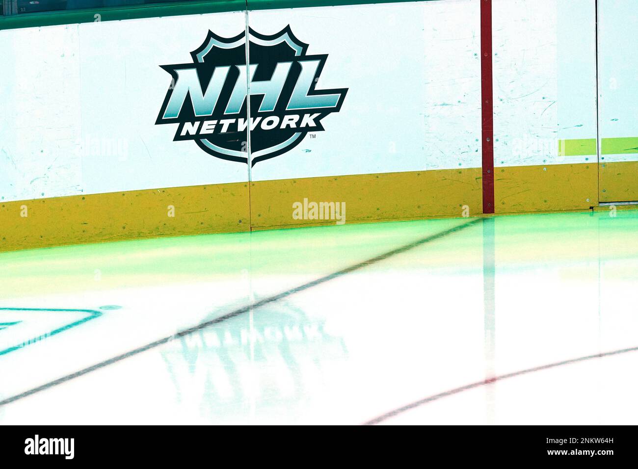 The NHL network shield / logo is seen on the boards above the ice before an NHL hockey game between the Philadelphia Flyers and the Dallas Stars on Saturday, Nov