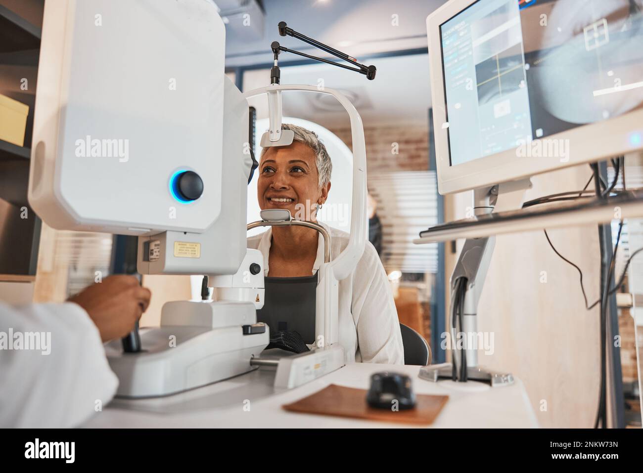 Machine, senior woman and test eyes in office, optometry and healthcare ...