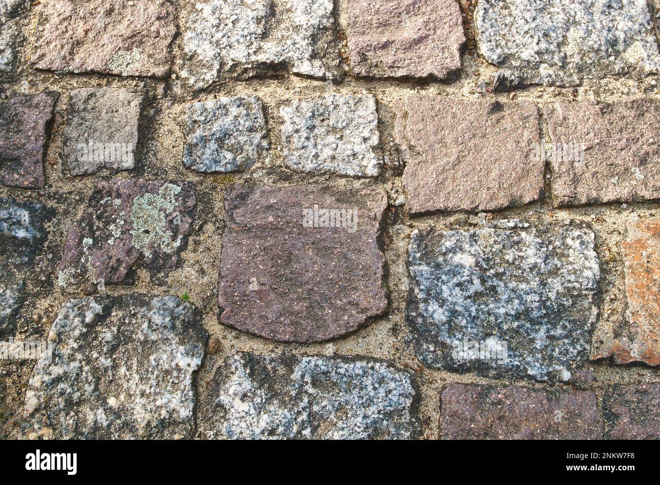 cobblestone natural stone with sand joints. Background image. Stone floor with natural stones. Detail image Stock Photo