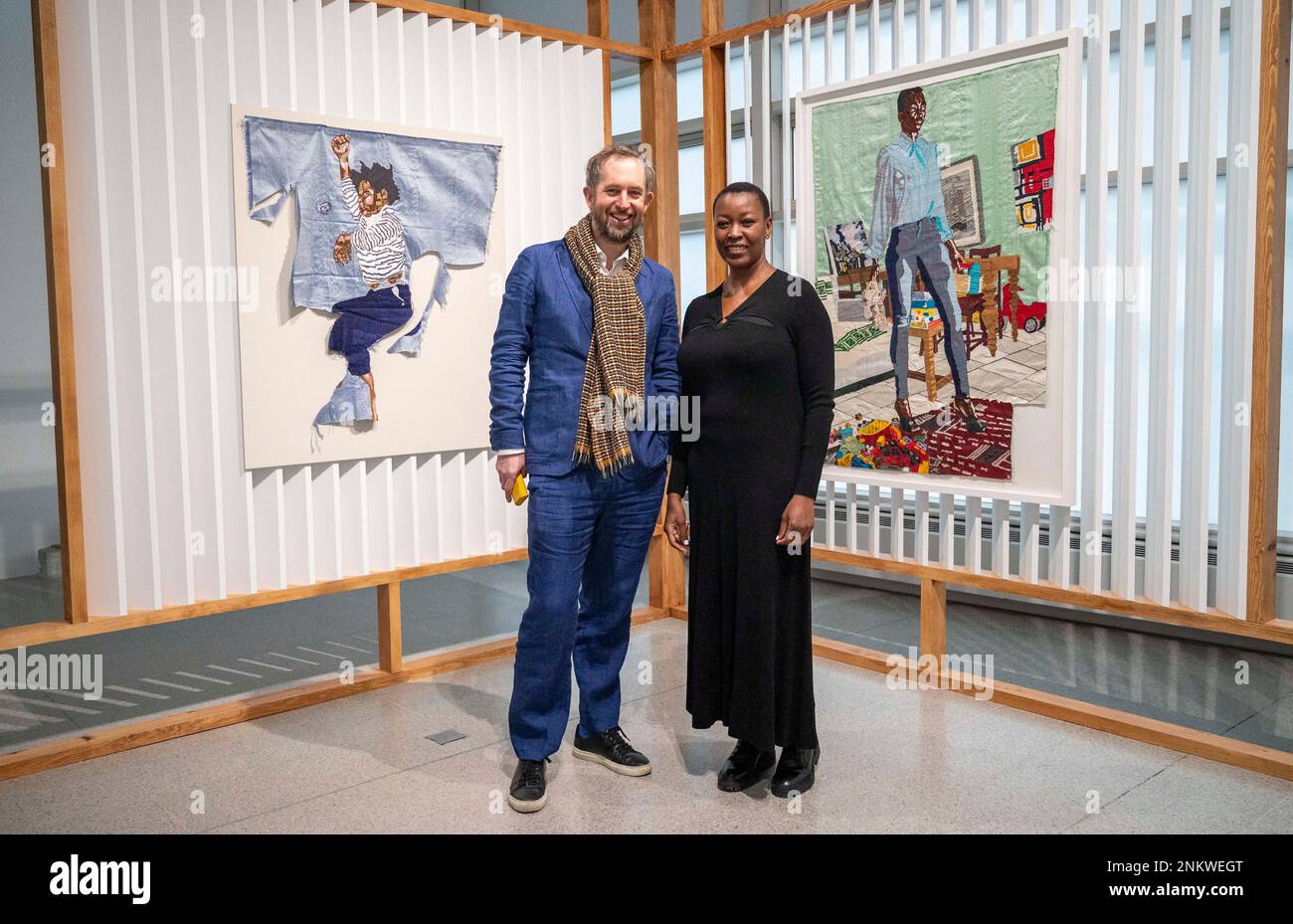 Brighton UK 24th February 2023 -  Ben Roberts (Director CCA Brighton) with Malawian artist Billie Zangewa at Brighton CCA where her first major exhibition A Quiet Fire is on until 14th May . The exhibition features a  retrospective of ZangewaÕs work from the last ten years. : Credit Simon Dack / Alamy Live News Stock Photo
