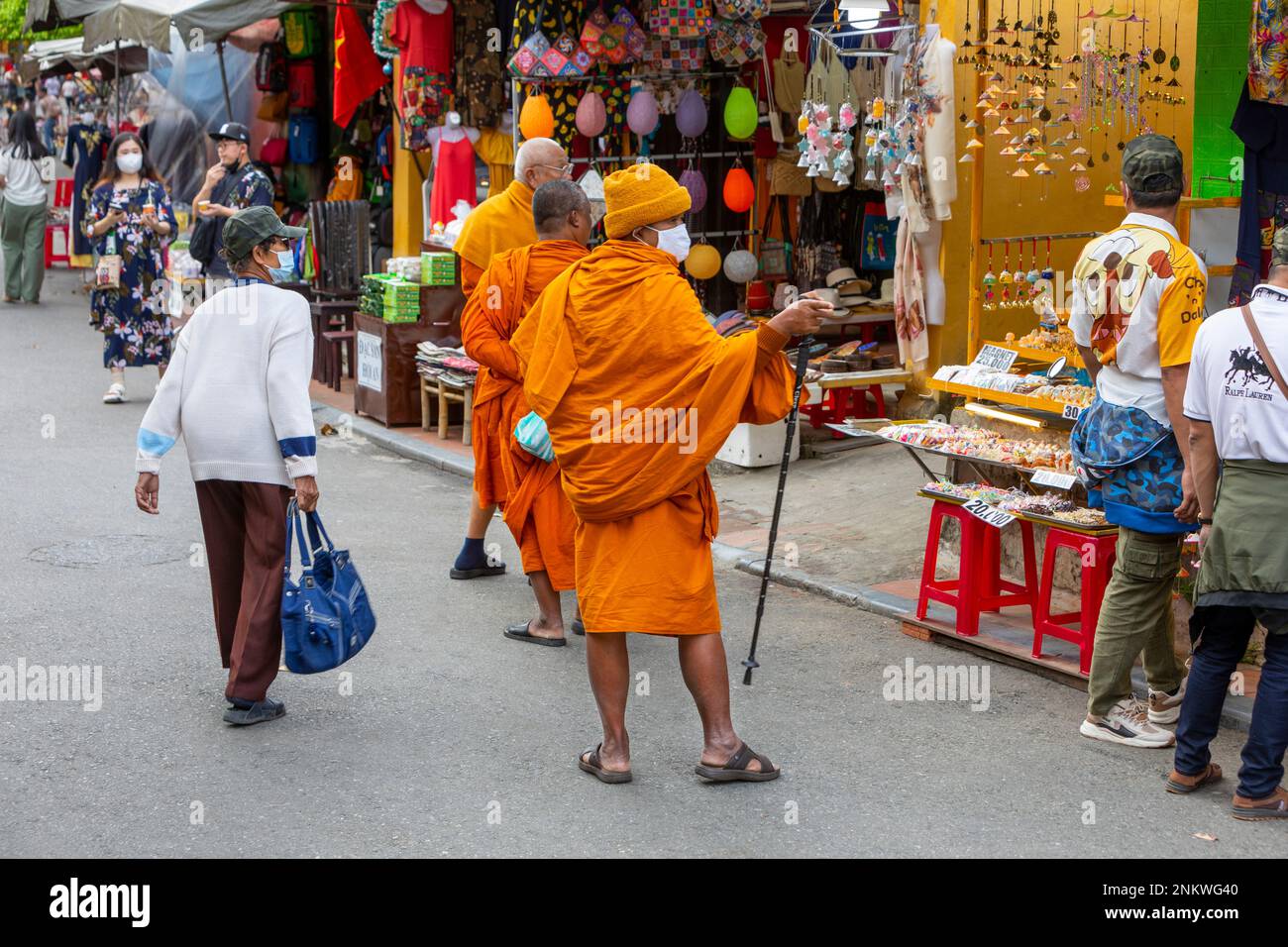 Three Buddhist Monks shopping for gifts in Hoi An Old Town, Vietnam