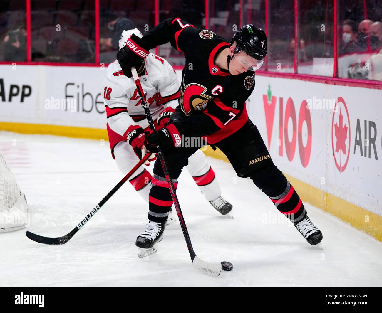 Ottawa Senators left wing Brady Tkachuk (7) controls the puck in front ...