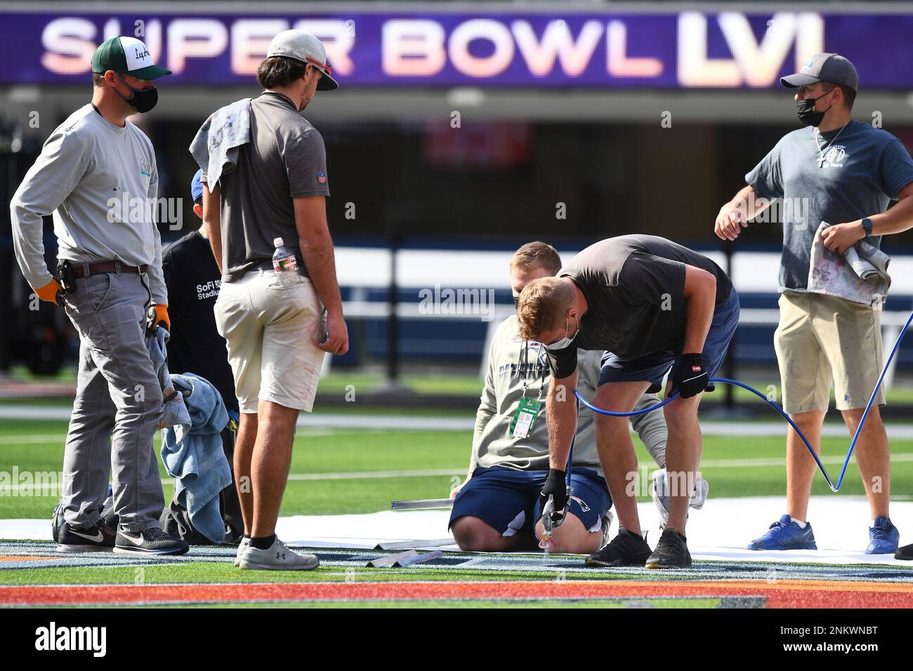 01 February 2022, US, Inglewood: Workers paint the Super Bowl LVI