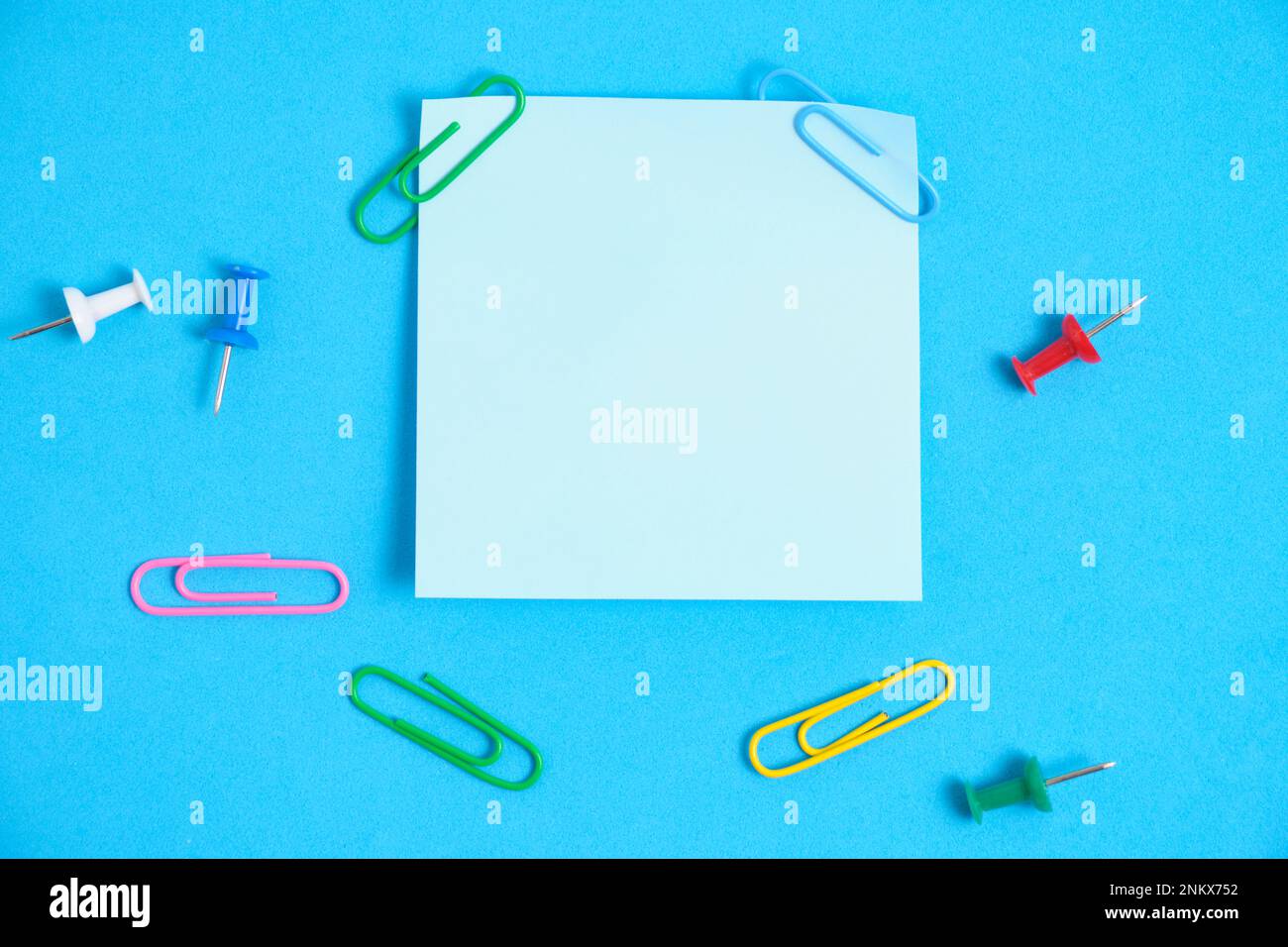 Blue paper stickers for writing notes on a blue background Stock Photo