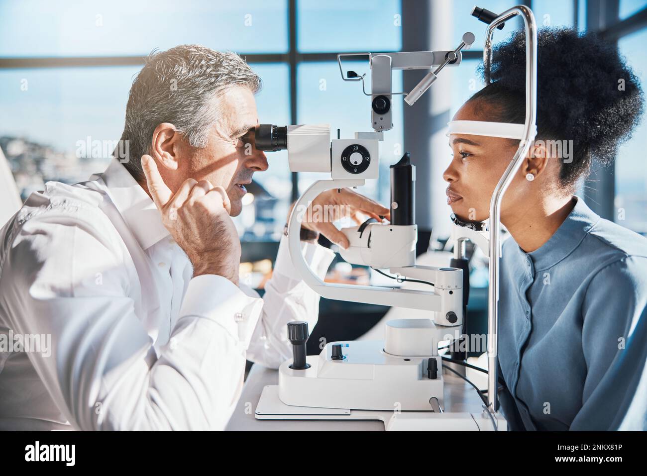 Eye doctor, machine or black woman consulting for help with eyesight