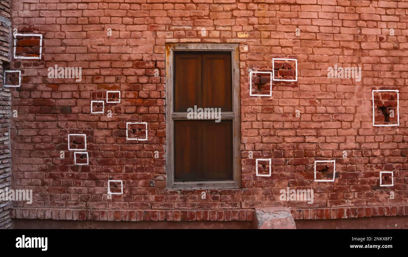 Bullets marks on wall of Jalianwala Bagh, Amritsar massacre that took place on 13 April 1919 by the order of Brigadier General Dyer, Amritsar, Punjab, Stock Photo
