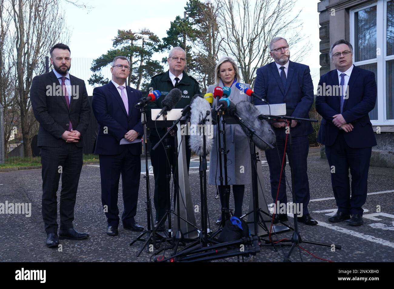 (left to right) SDLP leader Colum Eastwood, DUP leader Jeffrey Donaldson, Police Service of Northern Ireland (PSNI) Chief Constable Simon Byrne, Sinn Fein deputy leader Michelle O'Neill, Ulster Unionist Party (UUP) leader Doug Beattie, and Stephen Farry from the Alliance party, speaking to the media outside the PSNI HQ in Belfast, where they are meeting following the shooting of PSNI Detective Chief Inspector John Caldwell on Wednesday. Picture date: Friday February 24, 2023. Stock Photo