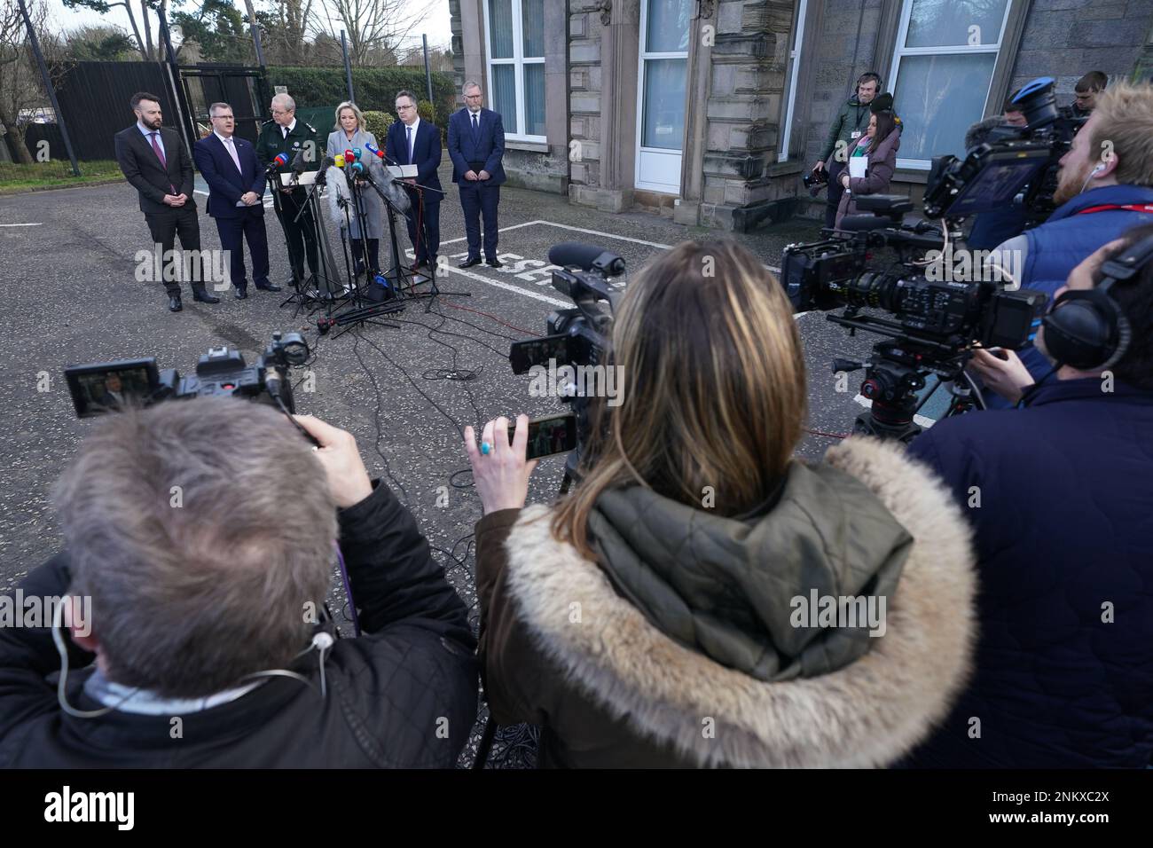 (left to right) SDLP leader Colum Eastwood, DUP leader Jeffrey Donaldson, Police Service of Northern Ireland (PSNI) Chief Constable Simon Byrne, Sinn Fein deputy leader Michelle O'Neill, Ulster Unionist Party (UUP) leader Doug Beattie, and Alliance party member Stephen Farry speaking to the media outside the PSNI HQ in Belfast, where they are meeting following the shooting of PSNI Detective Chief Inspector John Caldwell on Wednesday. Picture date: Friday February 24, 2023. Stock Photo