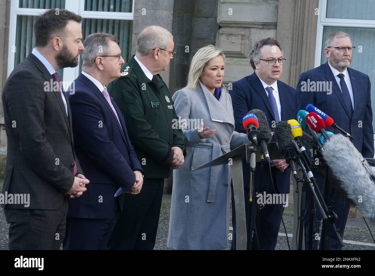 (left to right) SDLP leader Colum Eastwood, DUP leader Jeffrey Donaldson, Police Service of Northern Ireland (PSNI) Chief Constable Simon Byrne, Sinn Fein deputy leader Michelle O'Neill, Stephen Farry from the Alliance party, and Ulster Unionist Party (UUP) leader Doug Beattie, speaking to the media outside the PSNI HQ in Belfast, where they are meeting following the shooting of PSNI Detective Chief Inspector John Caldwell on Wednesday. Picture date: Friday February 24, 2023. Stock Photo