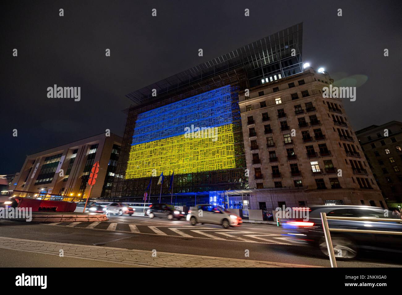 BRUSSELS, Belgium - February 23, 2023: seat of the European Council, with the Ukrainian flag projected on the facade in solidarity with Ukraine Stock Photo