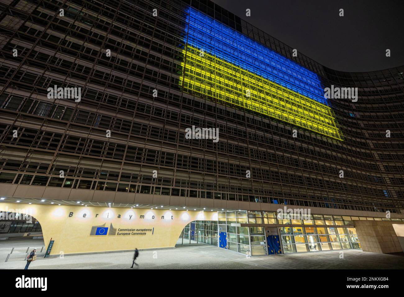 BRUSSELS, Belgium - February 23, 2023: Berlaymont building, seat of the European Commission, with the Ukrainian flag projected on the facade Stock Photo
