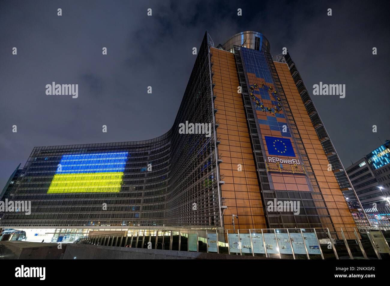 BRUSSELS, Belgium - February 23, 2023: Berlaymont building, seat of the European Commission, with the Ukrainian flag projected on the facade Stock Photo
