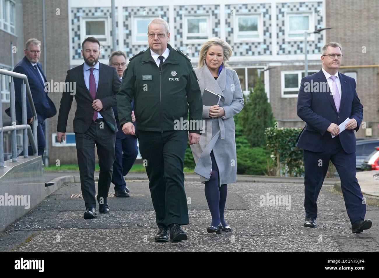 (left to right) Ulster Unionist Party (UUP) leader Doug Beattie, SDLP leader Colum Eastwood, Stephen Farry from the Alliance party, Police Service of Northern Ireland (PSNI) Chief Constable Simon Byrne, Sinn Fein deputy leader Michelle O'Neill, and DUP leader Jeffrey Donaldson, arriving for a press conference outside the PSNI HQ in Belfast, where they are meeting following the shooting of PSNI Detective Chief Inspector John Caldwell on Wednesday. Picture date: Friday February 24, 2023. Stock Photo