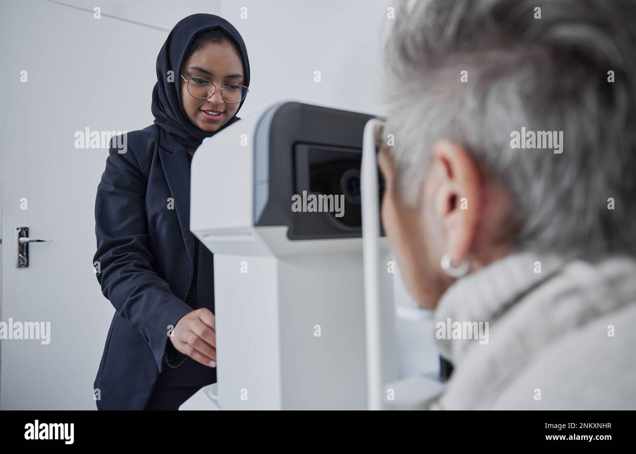 Optometrist, muslim woman and testing eyesight health in optometry lab