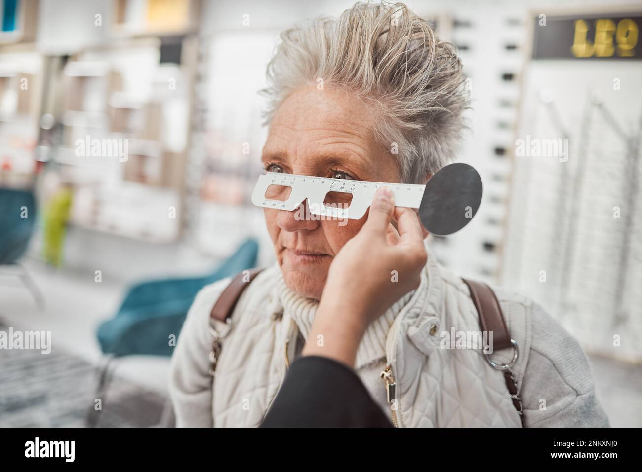 Optometry, measurement and doctor testing eyes of a woman for glasses
