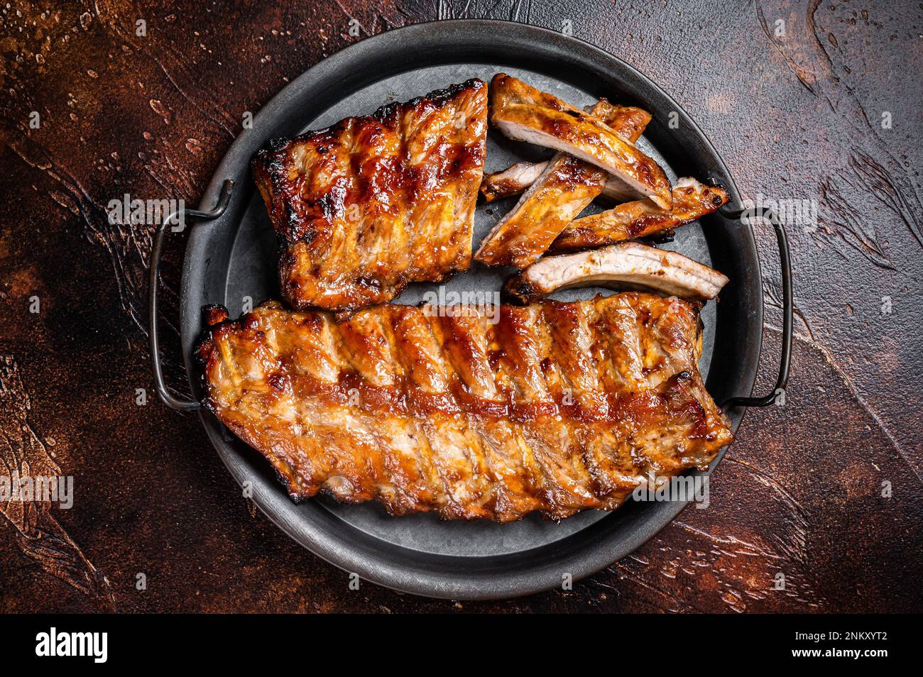 BBQ pork spare ribs St Louis with hot honey marinade in a steel tray ...