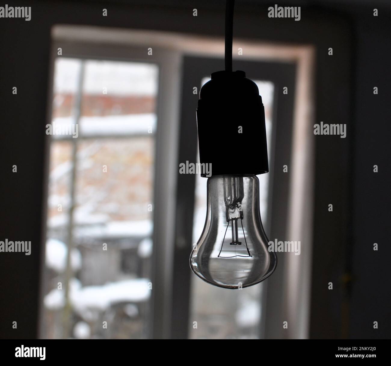 Due to the lack of electricity supply, the light bulb does not light up Stock Photo