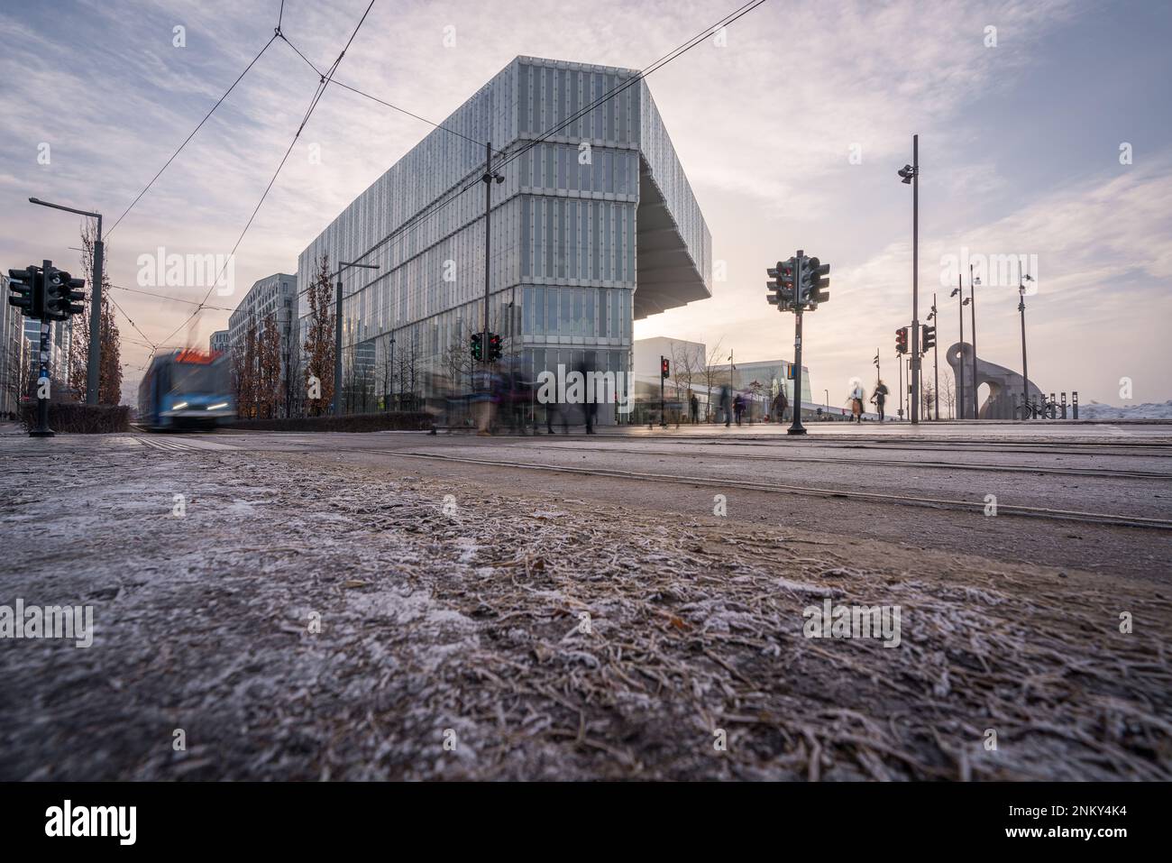 A tram passing the new Deichman Main Library in Oslo at a cold winter morning Stock Photo