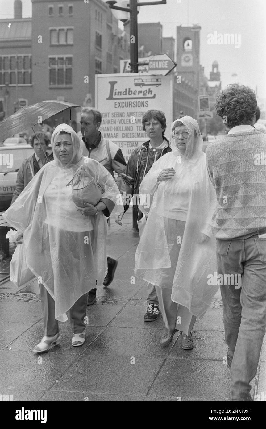 rainy-summer-weather-tourists-in-rainy-amsterdam-ca-1985-stock-photo
