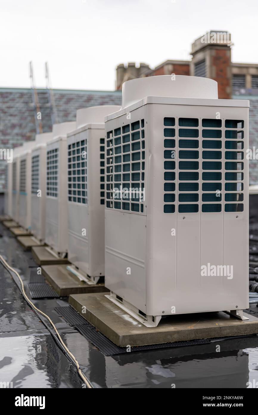 Air conditioning compressor units install on the roof of a commercial