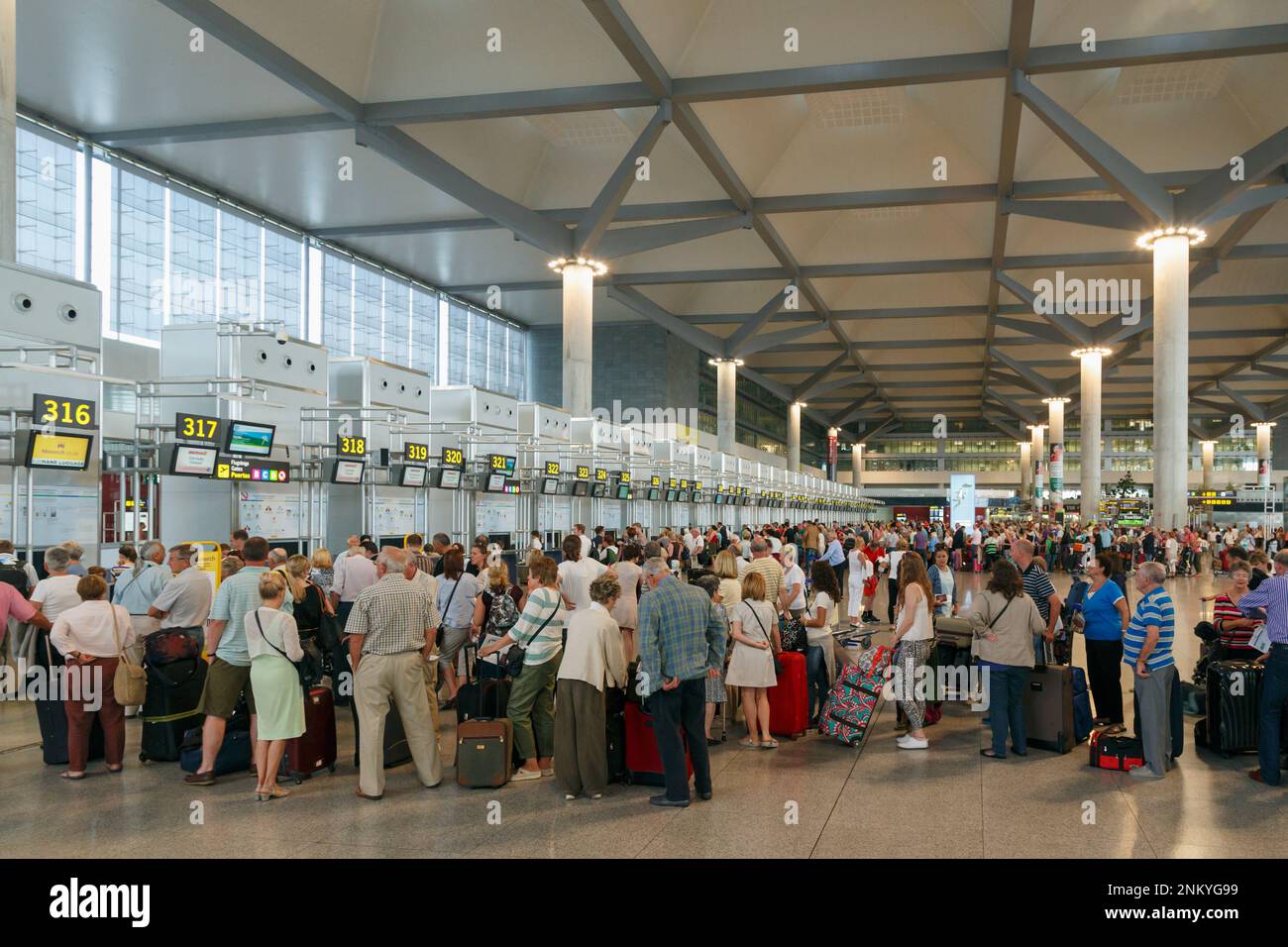 Malaga, Malaga Province, Costa del Sol, Andalusia, southern Spain.  Check-in queues at Malaga airport. Stock Photo