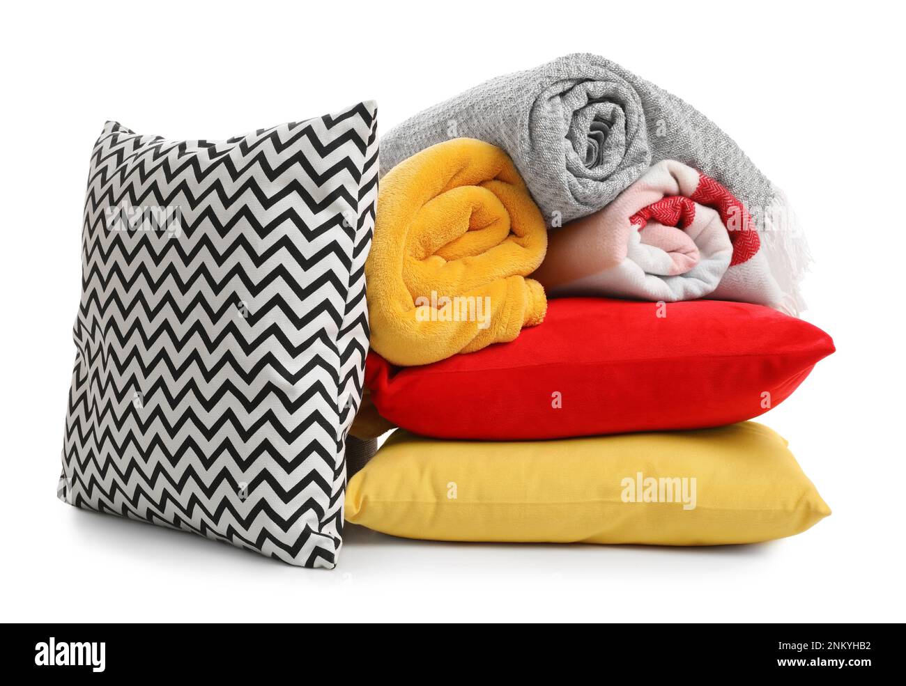 Stylish soft pillows and blankets on white background Stock Photo