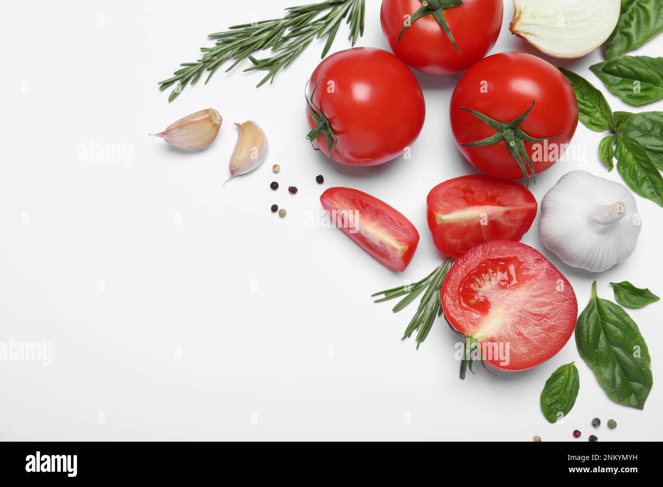 Composition with fresh basil leaves and tomatoes on white background ...