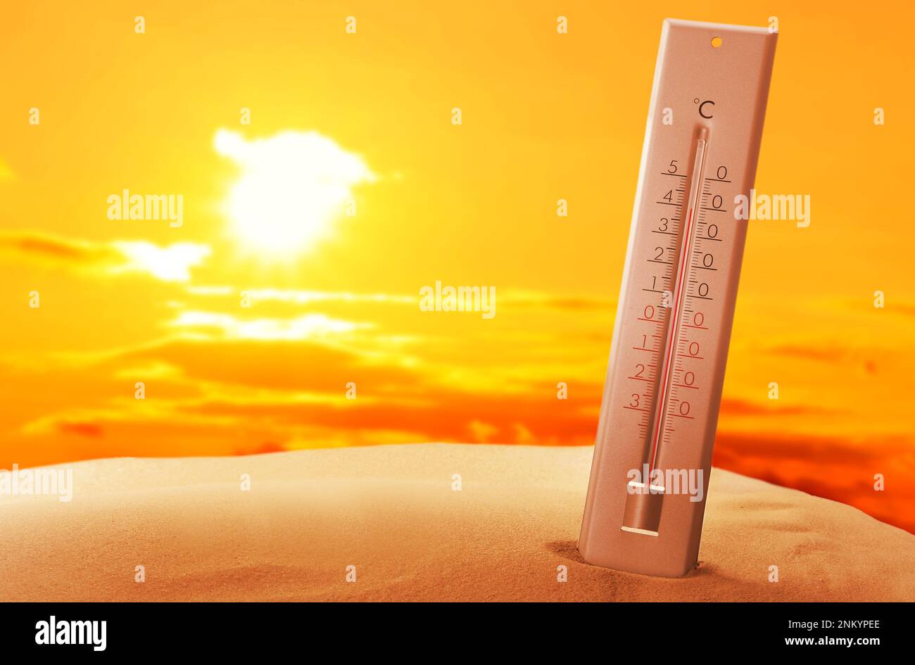 Weather thermometer with high temperature outdoors on hot sunny day
