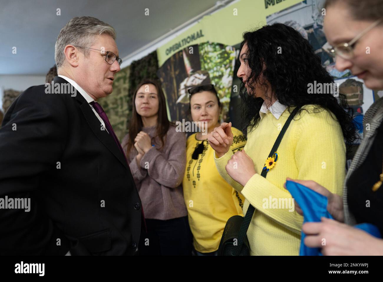Leader of the Labour Party Sir Keir Starmer meets local Ukrainian families during his visit to BCB International Cardiff, Wales, where staff are making medical supplies for the Ukrainian army. Picture date: Friday February 24, 2023. Stock Photo