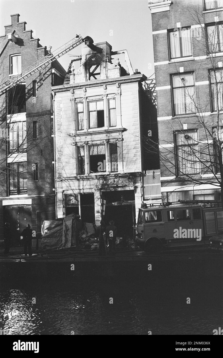 Netherlands History Firemen outside a burned out building in Amsterdam