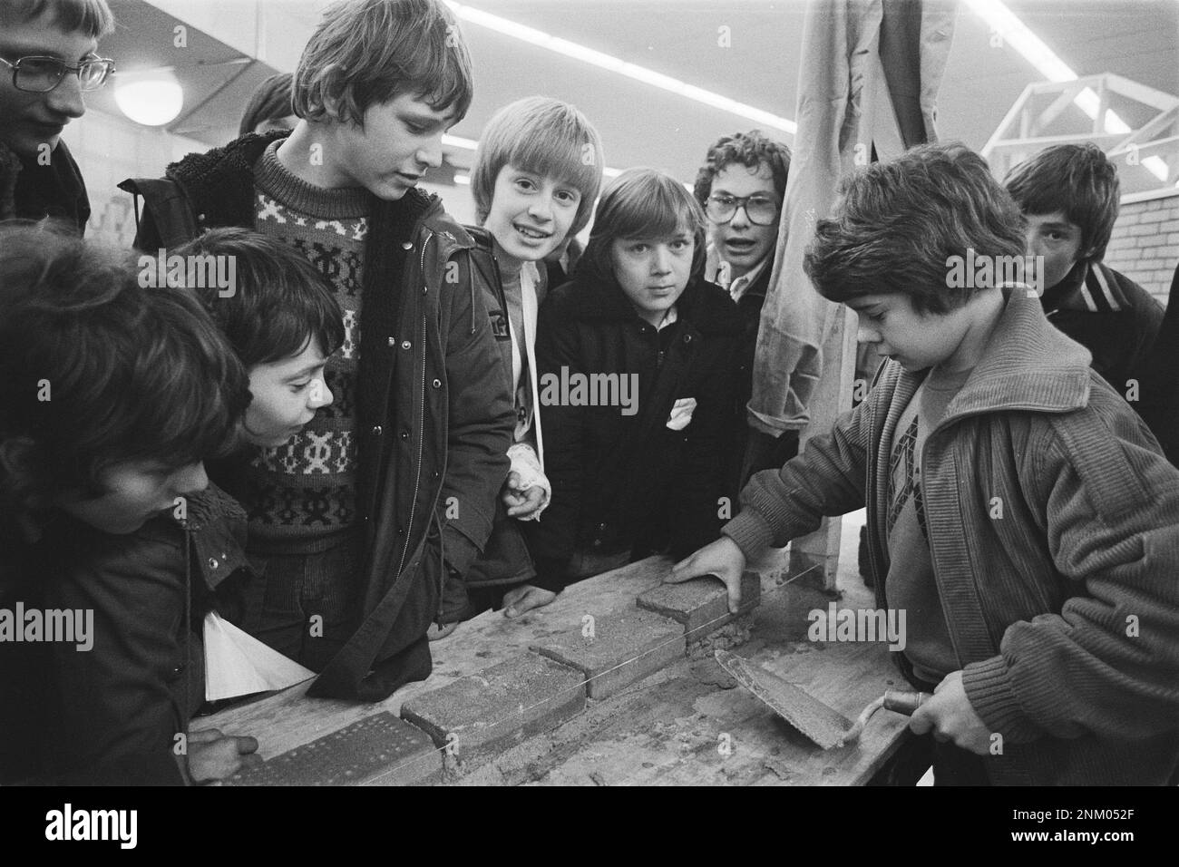 Netherlands History: 18th National Professions Meeting in the Jaarbeurs in Utrecht; boy bricklaying ca. February 25, 1980 Stock Photo