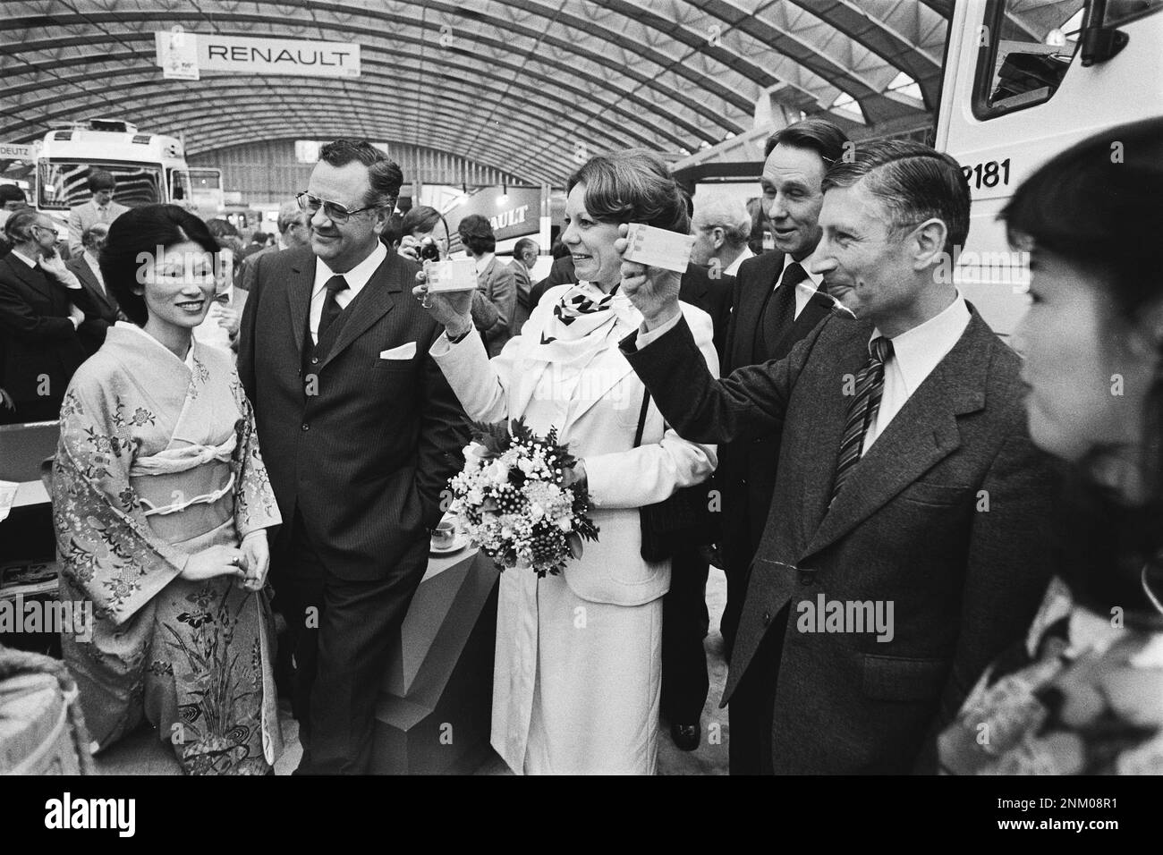 Netherlands History: Opening Bedrijfsauto RAI 1980 automobile show by Prime Minister Dries van Agt and State Secretary. Smith Kroes; drink Sake at Japanese car manufacturer exhibit ca. February 6, 1980 Stock Photo