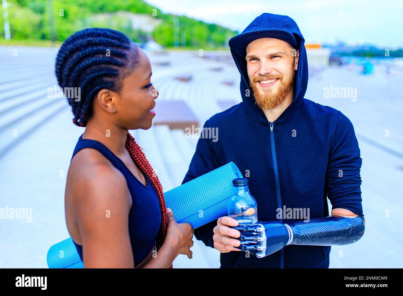 mixed race friends fitness training together outdoors summer morning Stock Photo