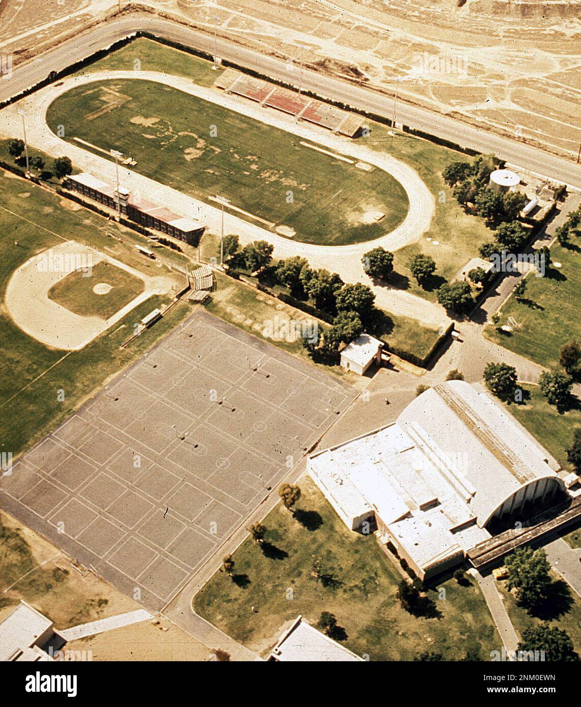 1970s United States Aerial view of high school atheltic fields and