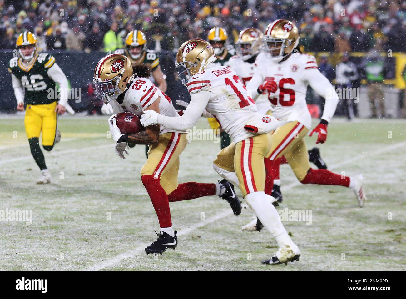 Green Bay, United States. 22nd Jan, 2022. San Francisco 49ers Talanoa  Hufanga (29) picks up a blocked punt in front of teammate River Cracraft  (13) and returns it for a touchdown against