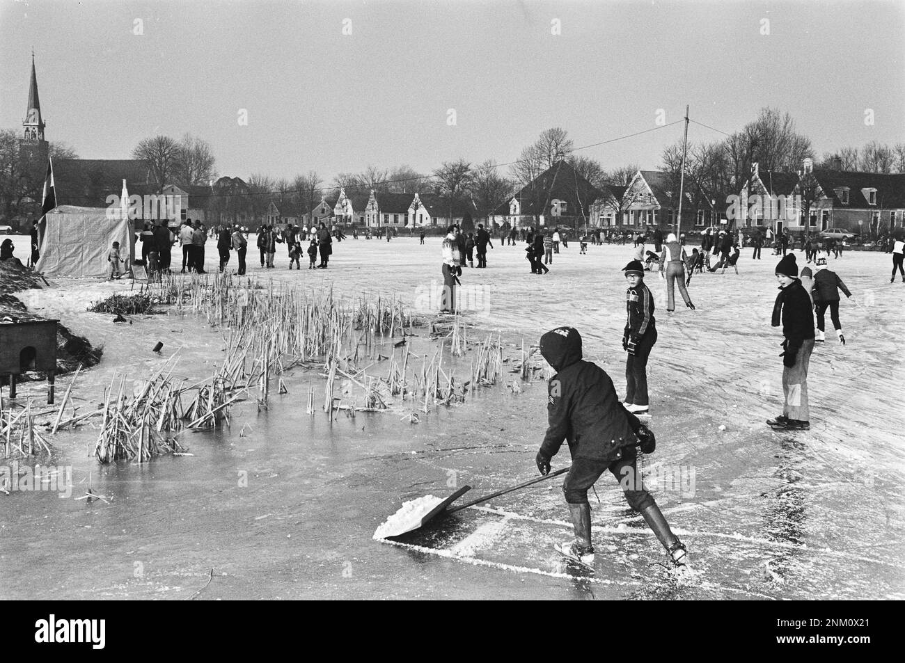 Netherlands History: Children having fun skating in Broek in Waterland ca. January 19, 1980 Stock Photo