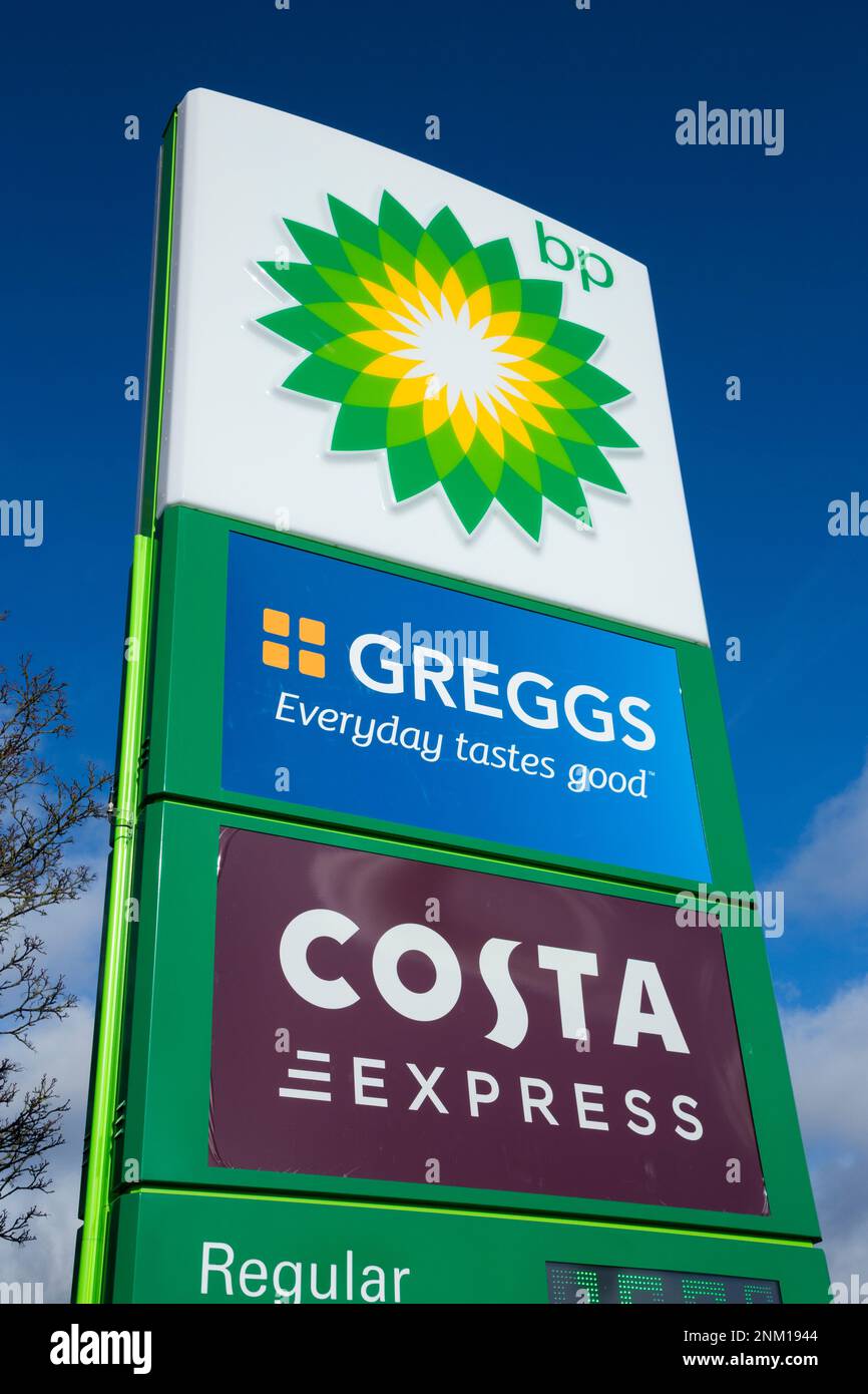 Sign at BP British Petroleum fuel petrol station forecourt at Frankley motorway Services, on the M5 motorway. Greggs the baker and Costa Express coffee cater for customers at the filling station. UK. (133) Stock Photo
