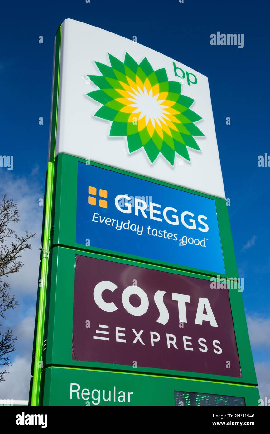 Sign at BP British Petroleum fuel petrol station forecourt at Frankley motorway Services, on the M5 motorway. Greggs the baker and Costa Express coffee cater for customers at the filling station. UK. (133) Stock Photo