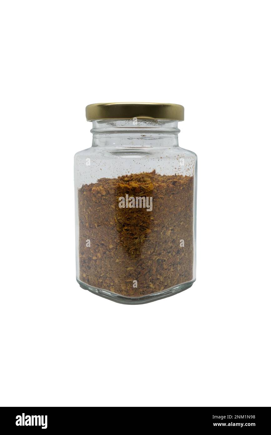 Chili powder in a glass jar with closed lid. Isolated on white background with clipping path