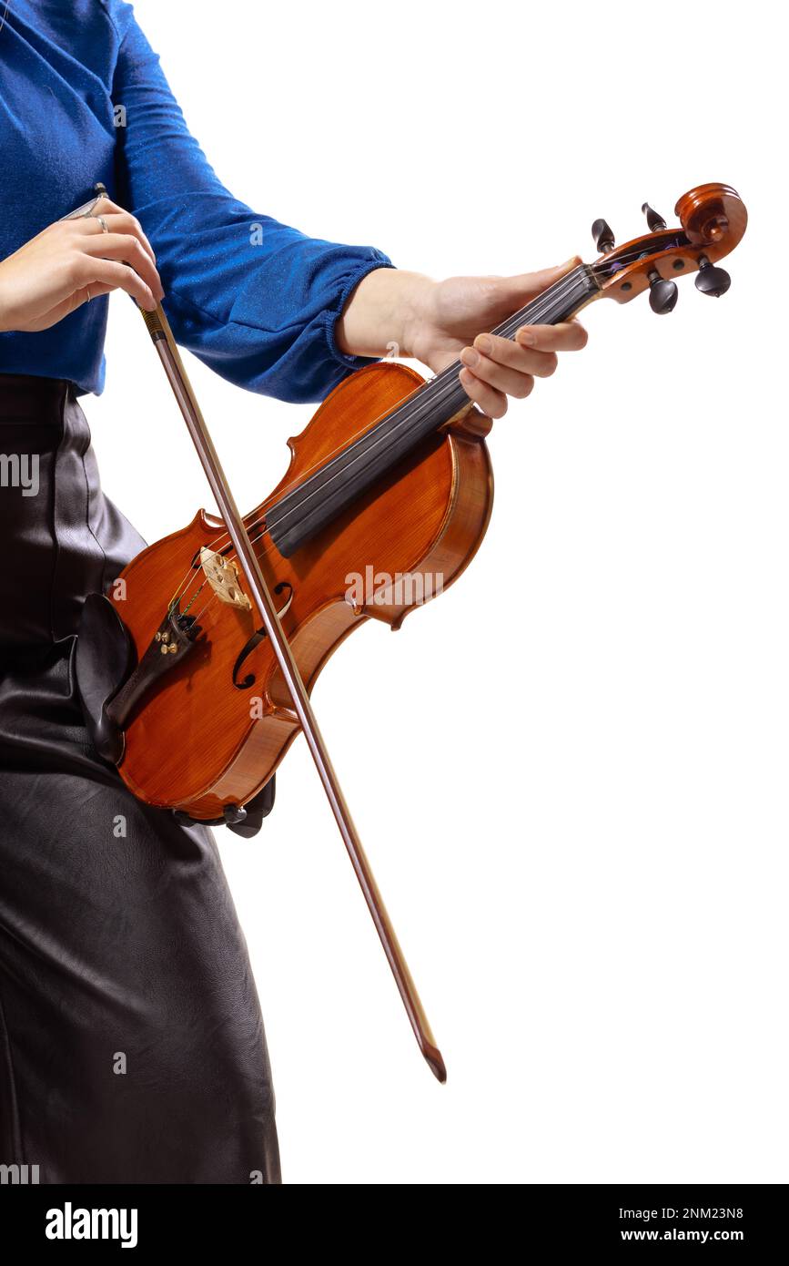 Abstract elegant girl holding a violin. Female violinist isolated on white background. Stock Photo