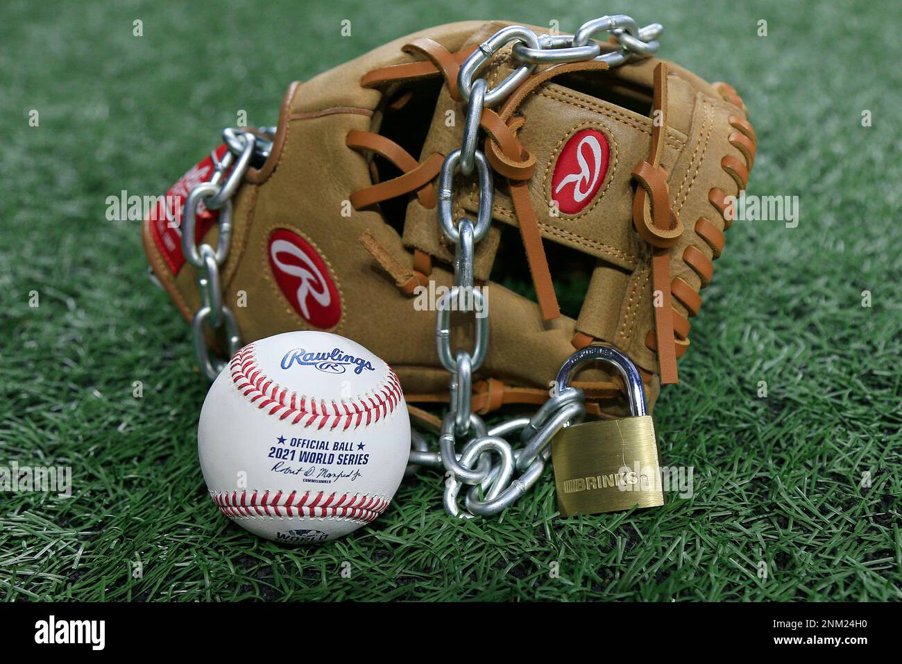 Atlanta, GA - January 09: An Official Rawlings Major League baseball sits  with a glove, lock and chain to represent the lockout between Major League  Baseball (MLB) and the Major League Baseball